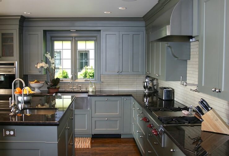 Gray kitchen cabinets with black counter